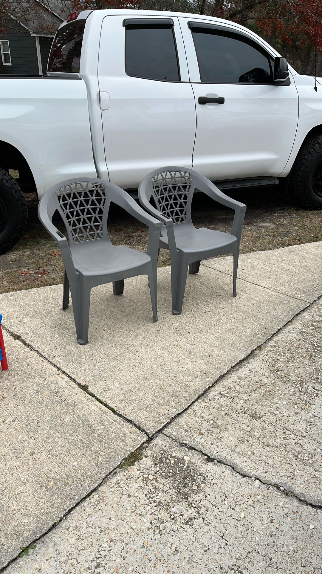 Two Gray Plastic Chairs Take Both For 10