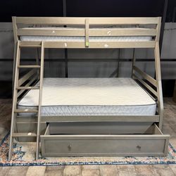 Nice bunk bed from Ashely Furniture, size Twin over Full. Mattresses included. Delivery available for an additional cost. 