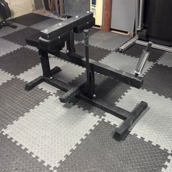 Seated calf raise machine