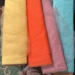 Tulle fabric bolts orange yellow teal blue and purple
