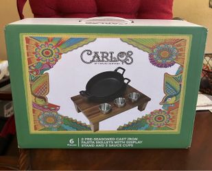 2 pre seasoned cast iron skillets set with table