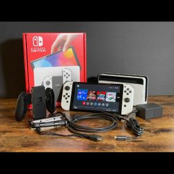 Nintendo switch oled Brand New in The Box With Two Games 