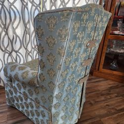 A Timeless Classic: Vintage Green and Gold Wingback Chair