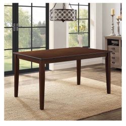 Better Homes & Gardens Bankston Dining Table, Mocha. Assembled. A little bit scratched   Dimensions: 58.5"L x 35.5"W x 30"H