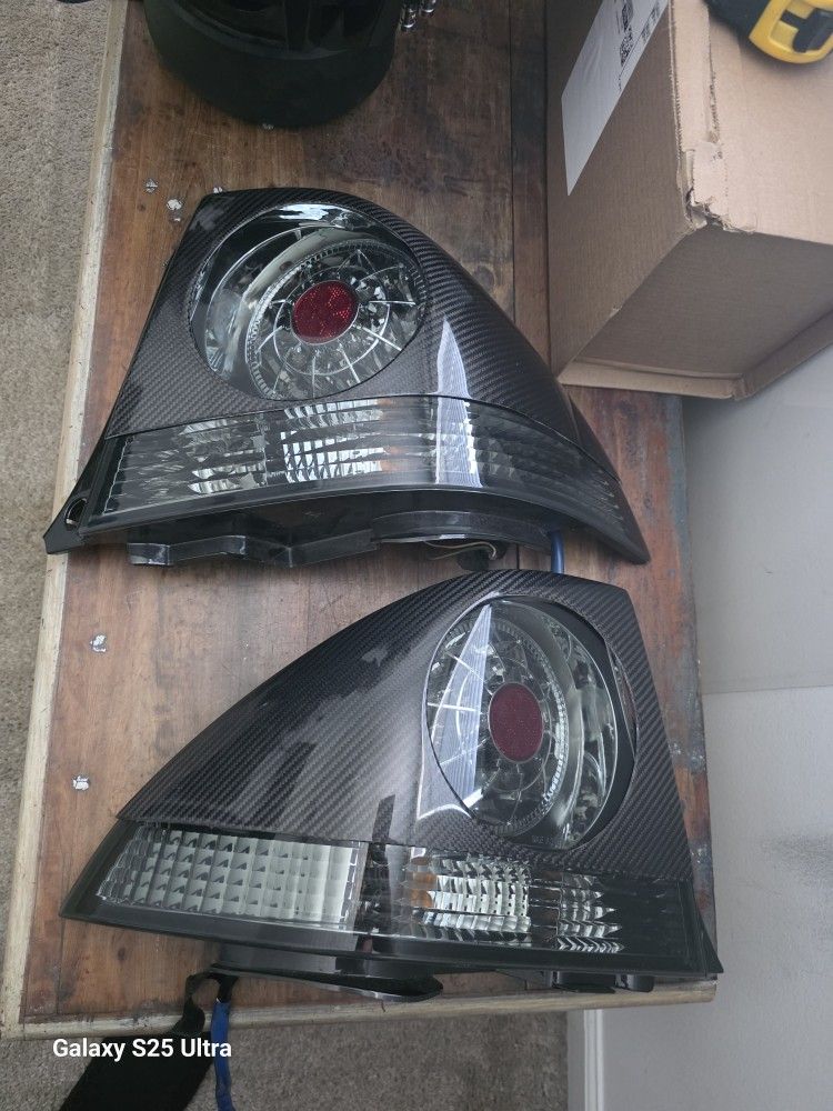 Clear Is300 Taillights With Free Carbon Fiber Covers.