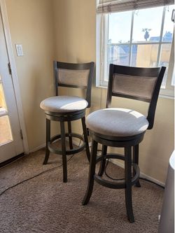 Cushioned bar chairs with backs