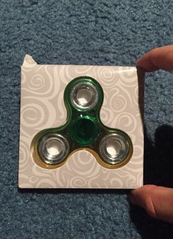 Gold and green fidget spinner