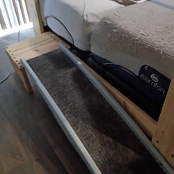 Homemade theater style bed with two extra large twin adjustable inserts inside the bed and a 55 in flat screen television mounted at the rear we are m