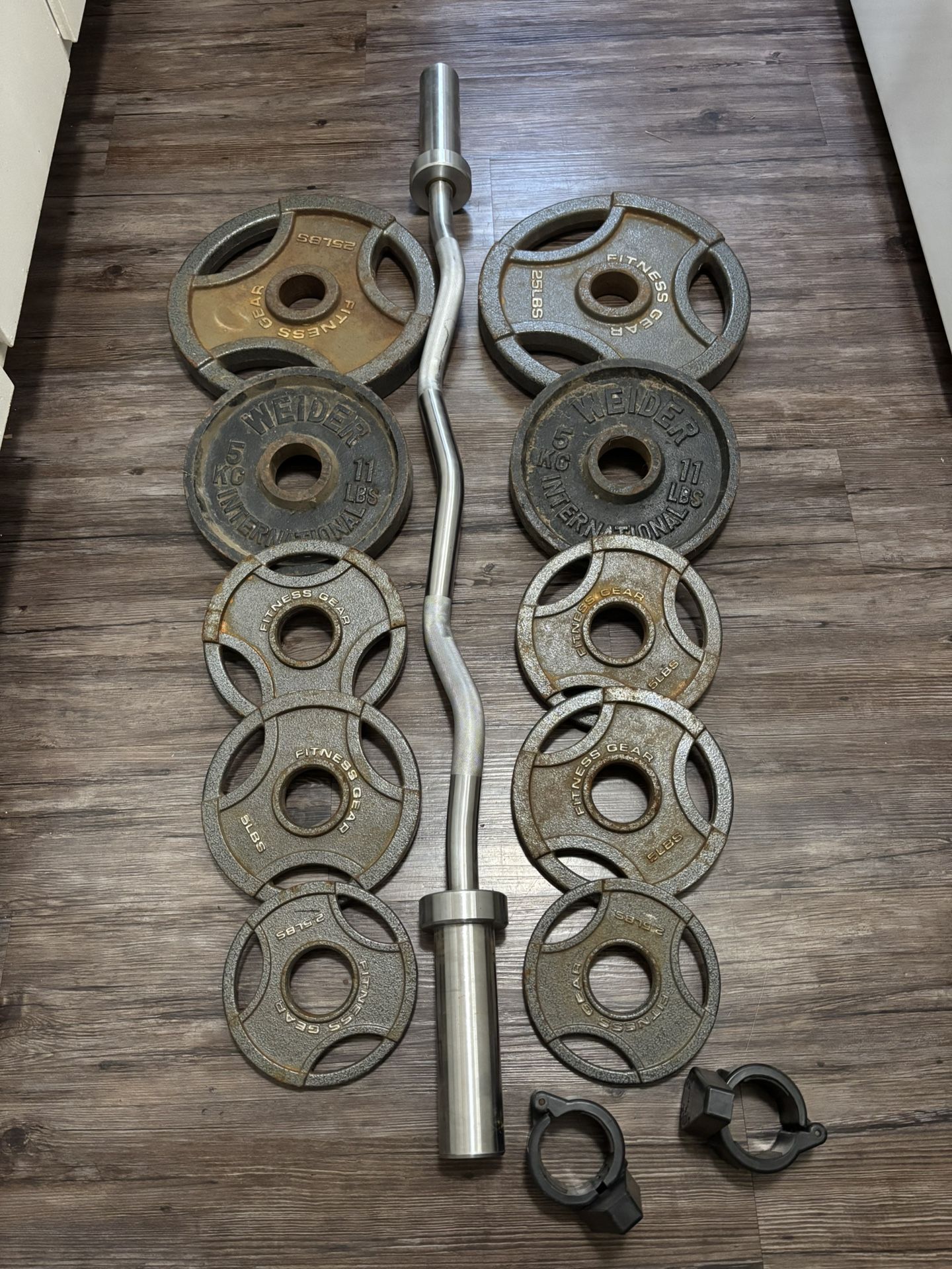 Solid Curl Bar With Brass Bushings And Olympic Weights 2x25, 2x11, 4x5 And 2x2.5 Lbs With Collars