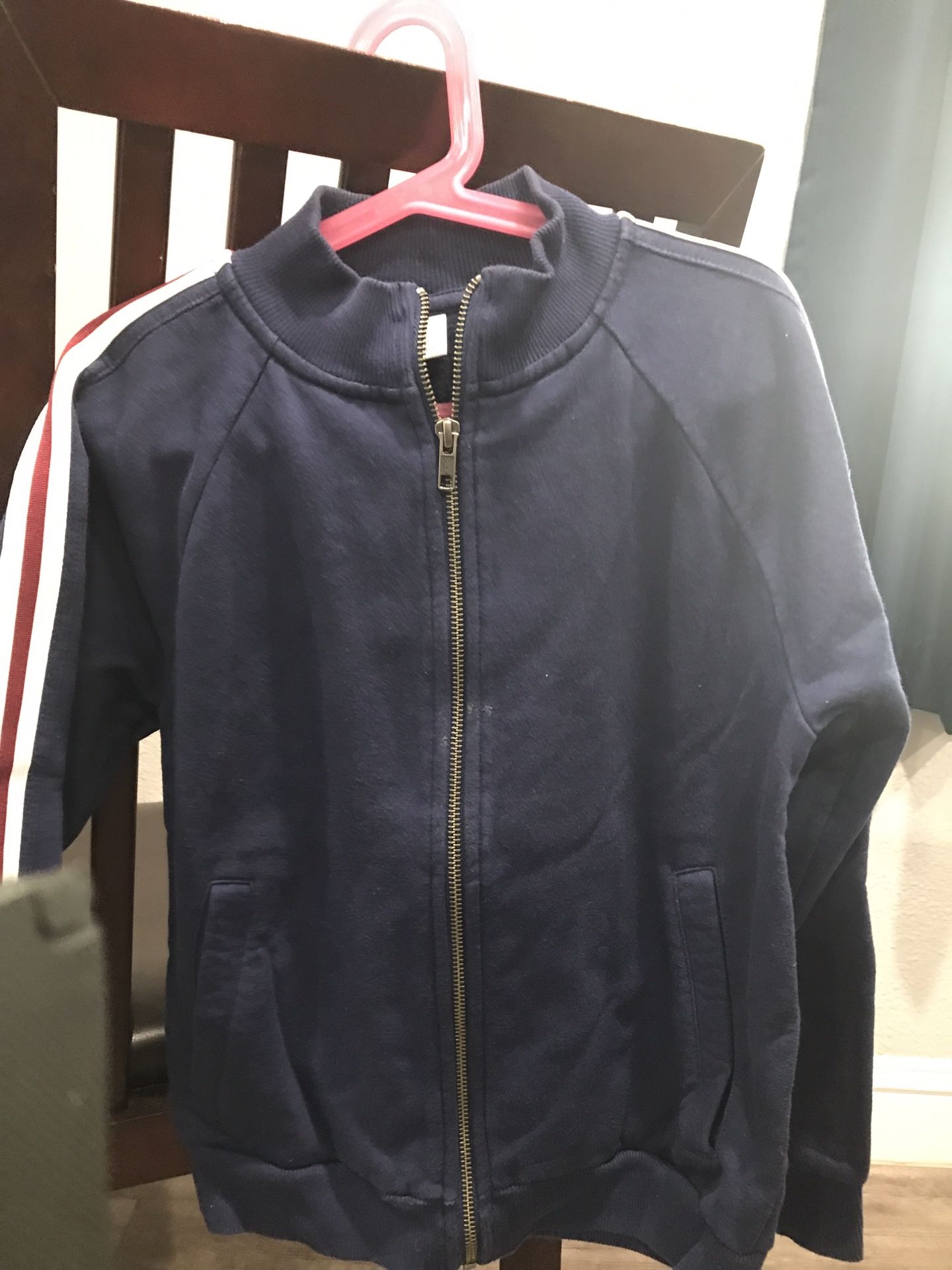 Navy Blue With White & Red Stripe on Sleeve. 