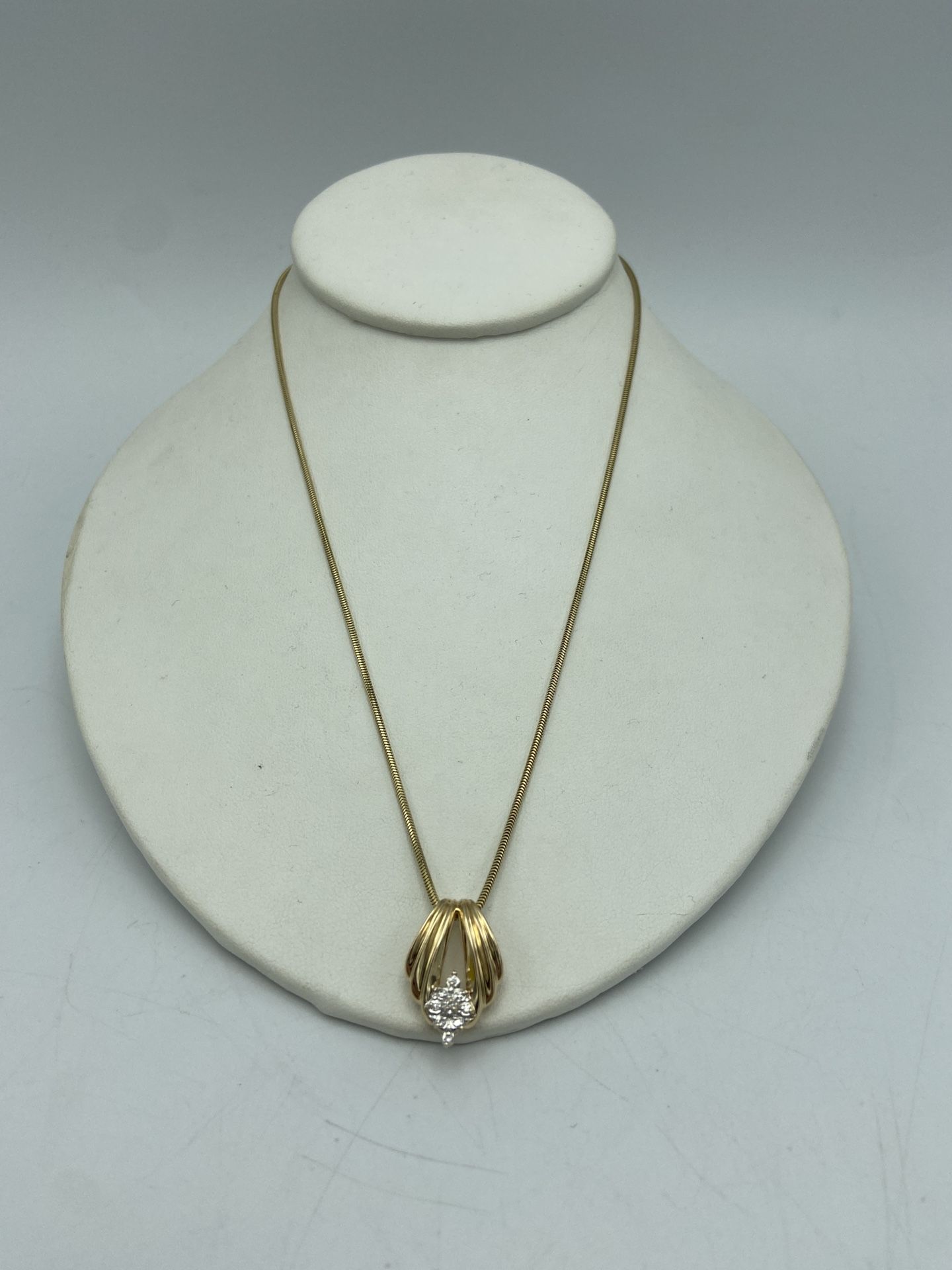 14kt Yellow Gold Diamond Pendant with Snake Chain 18”