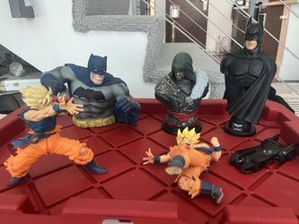Batman Begins Dark Knight ($90) / Assassins Creed Ezio ($90) / DBZ Goku ($15) / Dark Knight Coin Bank  ($40), Batmobile ($10) Toys Figurines Bust 