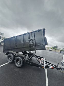 NEW DUMP TRAILER 8X12X4 12000 LBS
ROLLING TARP--SPARE TIRE,ELECTRIC BRAKES,HYDRAULIC SYSTEM,REMOTE CONTROL,IDEAL FOR HAULING, DEMOLITION, TRASH ETC,FO