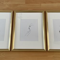 3 gold art frames with drawings