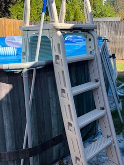Swimming pool ladder above ground
