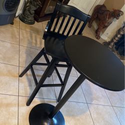A Nice Side Table With A Metal Bar Put On Top