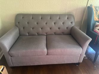 Gray Tufted loveseat