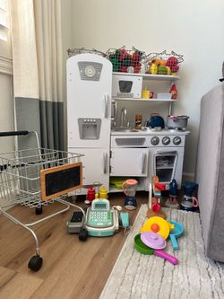 Play kitchen with shopping cart, register, appliances and food