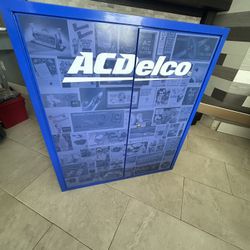 ACDelco Metal Parts Storage Parts Cabinet . The Exterior Features A Blue Finish With A Collage Of Vintage ACDelco Advertisements.
