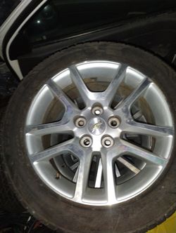 2 Full Sets Of Chevy Rims And Tires.