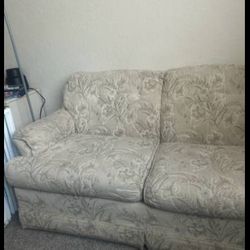 tan colored couch with flower design