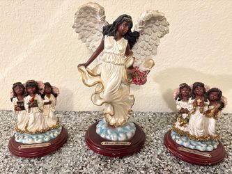 Set of three Ebony Heritage angel figurines.