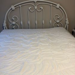 White wrought iron queen headboard