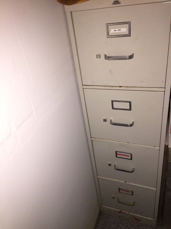 Two four drawer filing cabinets
