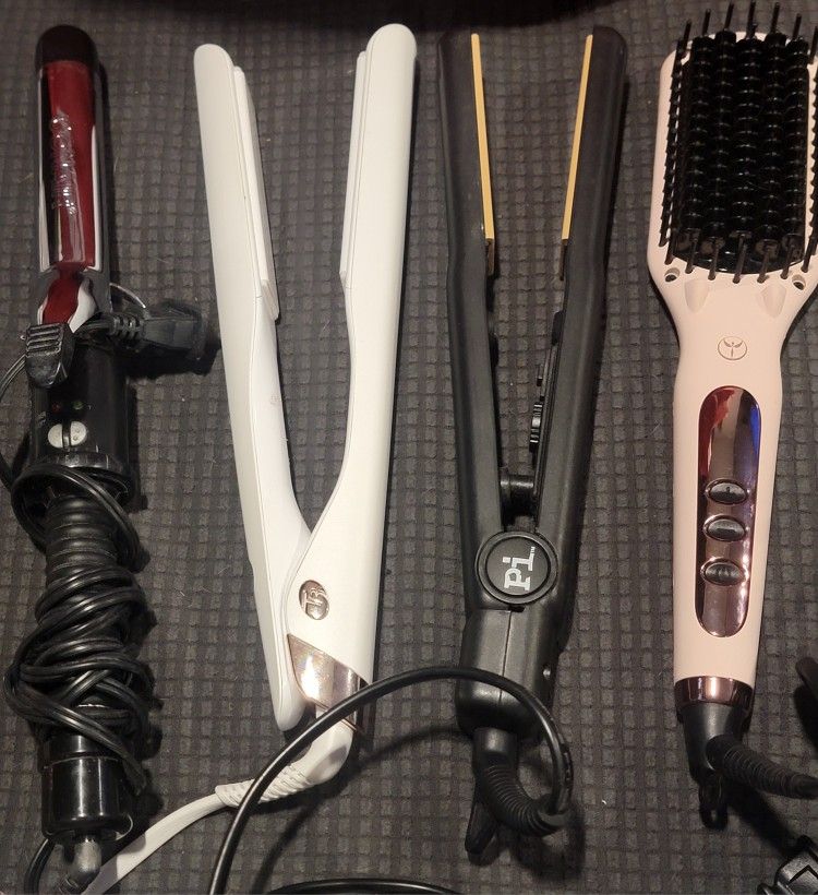 3 Hair Straighteners And A Curling Iron