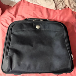 COMPUTER BAG; 15"w x 5"d x 13"high; cross streets are Arapaho & Waterview