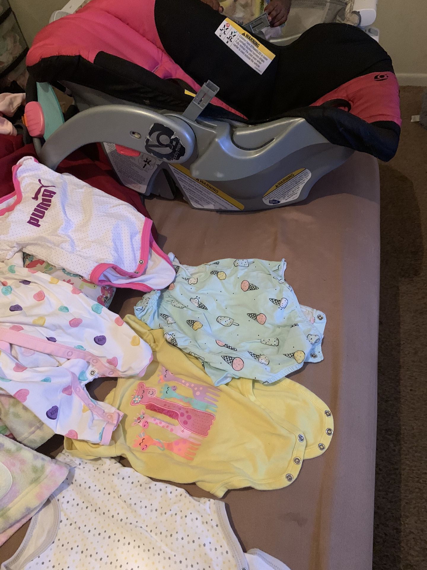 Baby clothes and car seat