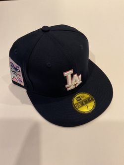 New Era La Dodgers black with pink outline around the logo and a pink patch on the side size 7’ $35