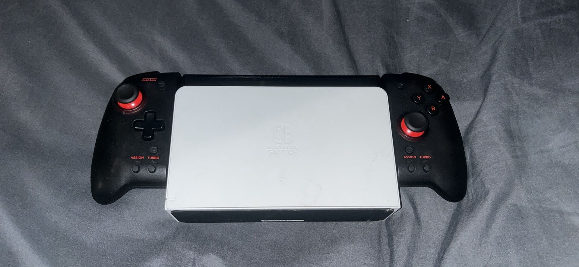 nintendo switch oled with racing controllers