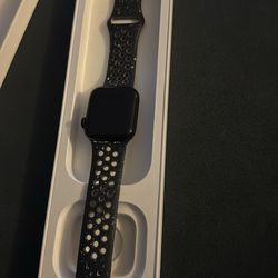 Apple watch by nike color blue ish and white spots
