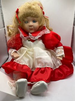 A vintage Anco Windup Musical Swaying Doll