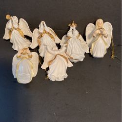 Small porcelain angels with gold trim. Three dollars each.