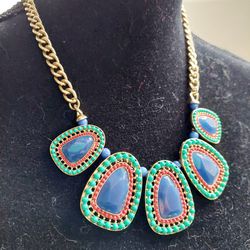 18" Gold Toned Chain Link Necklace with Beautiful Blue, Green and Red Stones. Pre-owned in excellent condition. Fashionable Costume Jewelry. Ships via