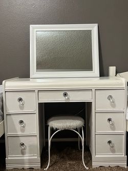 White vanity with chair