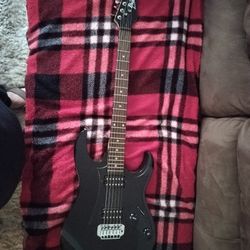 Ibanez Pearl Black Guitar/Husqvarna Chainsaw 