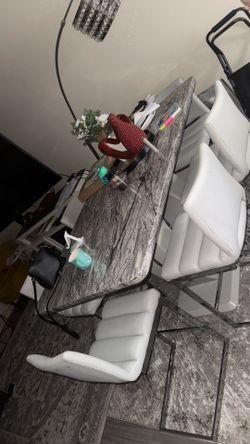 Marble Top Dining Table with White Chairs