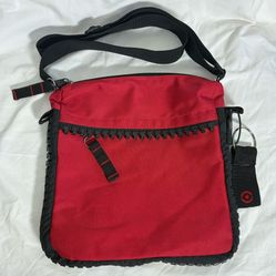 Very unique red nylon bag with huge working zipper accents  