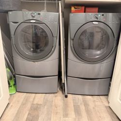 Priced To Sale. Set of Whirlpool Duet front-load washer and dryer machines