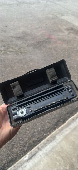 single-DIN car stereo head unit with a detachable faceplate