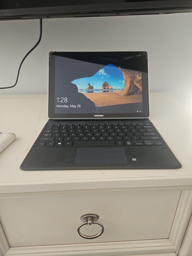 Samsung Galaxy Book, a 2-in-1 device that functions as both a tablet and a laptop TRADE FOR HEADPHONES (Read Description Please) $45obo