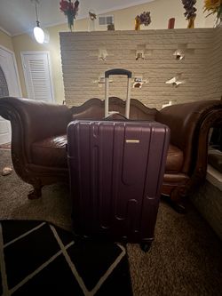 Samsonite Purple Suitcase 28"x18"x12" Large purple suitcase with wheels and retractable Very little rip from inside Hard shell suitcase Auto reply to