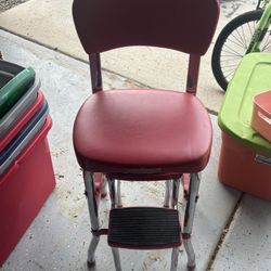 Chair with sliding stool 