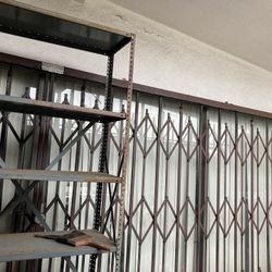 Large Metal Sliding Scissor Gate For Business Home. The Gate Was Cut In Half To Be Removed. Has Some Rust  and A But Dirty