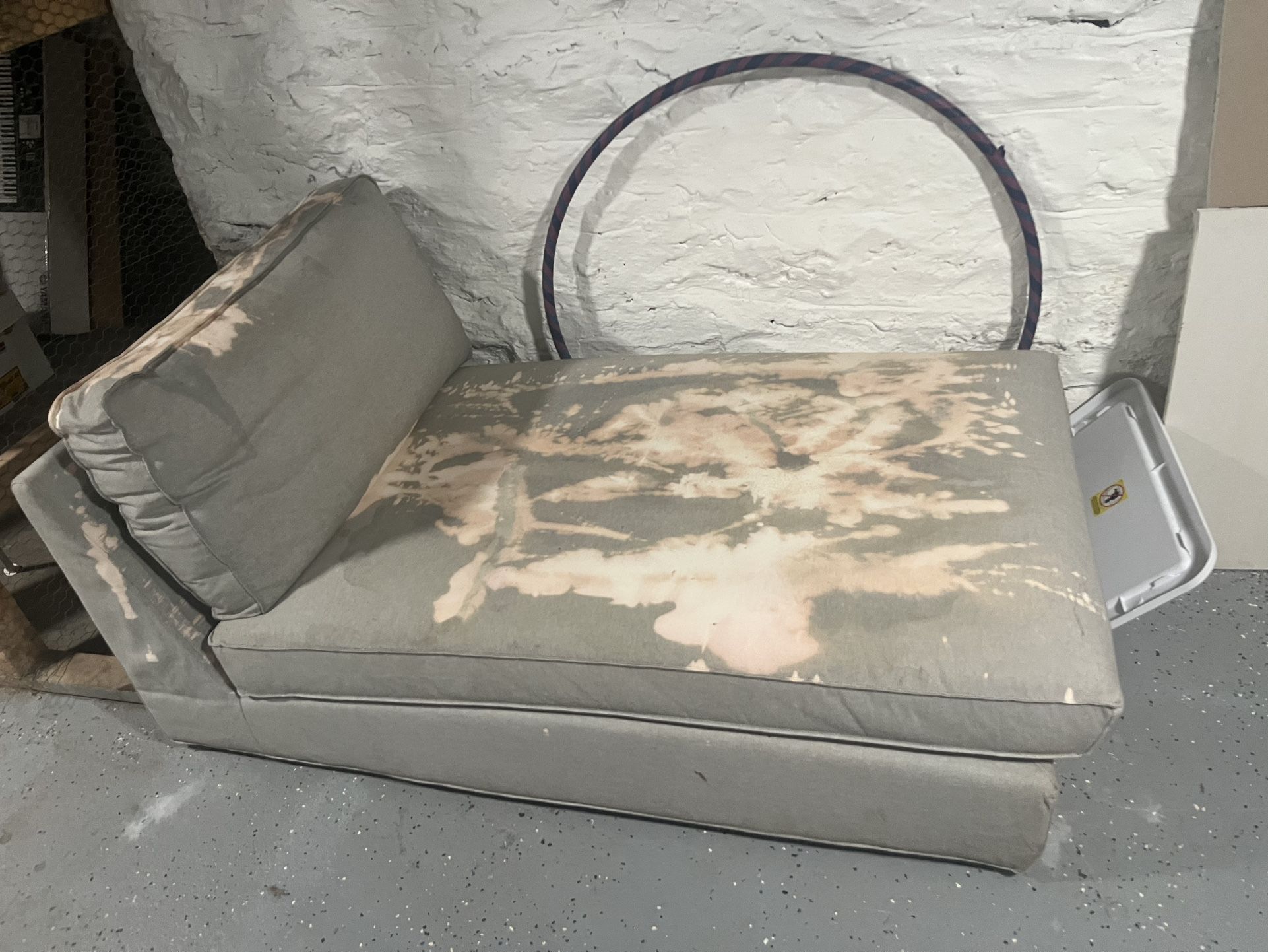 Green Couch With Large Bleach Stain