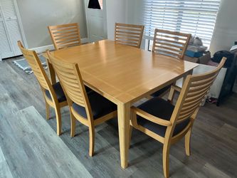 Dining room table  (Tan/Birch). Grey cushions