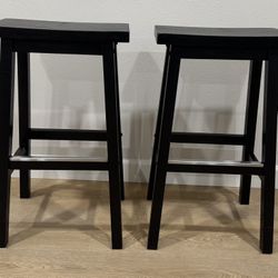 Two Black Solid Wood Saddle-Seat Counter Height Bar Stools